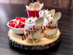 Three small jars filled with banana split dessert