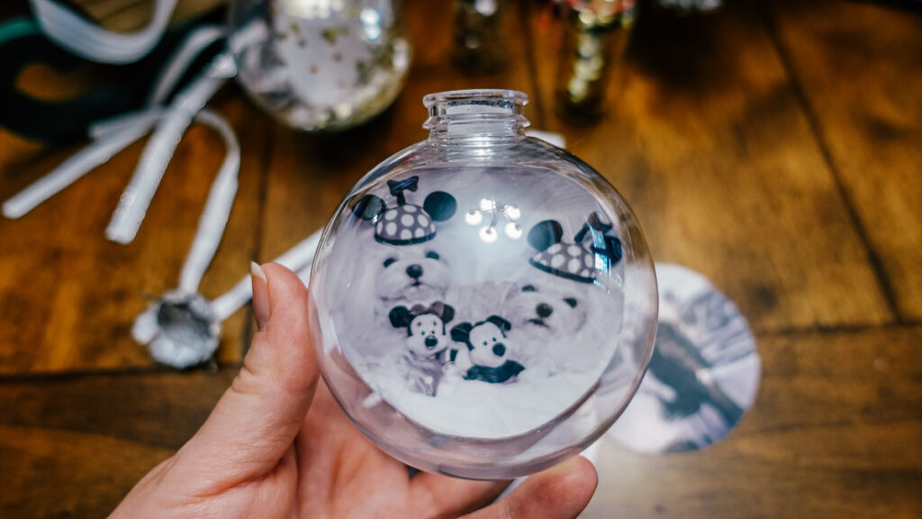 clear ornament with a photo of two Maltese inside