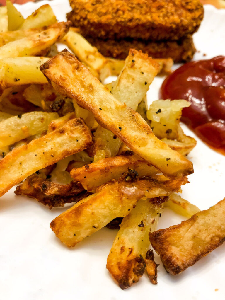 garlic fries on a white plate