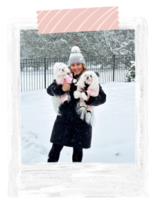 Jen holding Emmy and Aysia standing in the snow