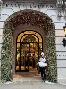 Jennifer holds Emmy in front of Ralph Lauren in New York City